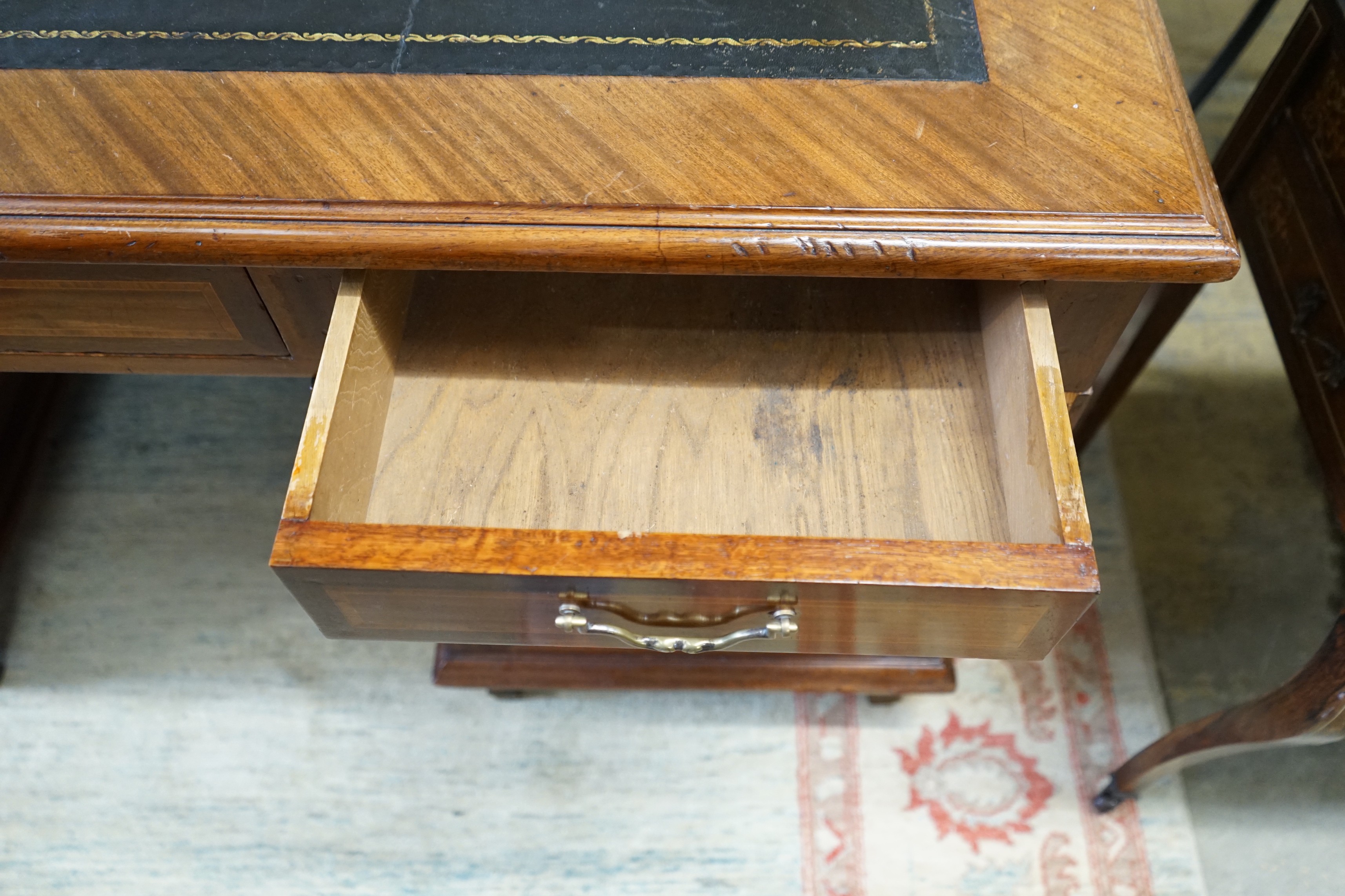 A mid 20th century French satinwood banded mahogany pedestal partner's desk, length 150cm, depth 98cm, height 79cm
